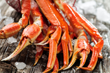 Snow crab clusters on ice on top of wood thumbnail
