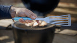 Hand holding a fish spatula thumbnail