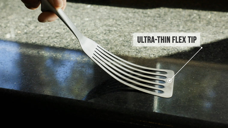 Fish spatula being flexed and showing "ultra-thin flex tip" feature