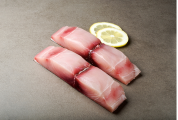 mahi fillet with lemon off to the side  