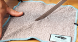 Knife sliding across cut-proof oyster shucking cloth  thumbnail